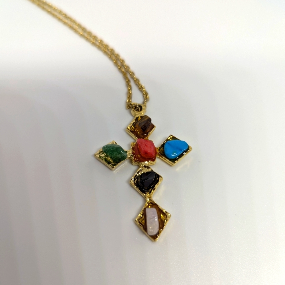 Jeweled Cross on gold tone cross on chain.